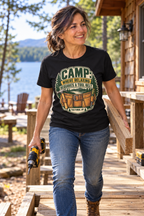 Woman carrying a board and drill at lakeside camp wearing the Old Forge Camp Tool Belt t-shirt