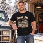 Man wearing Indian Lake truck and snowmobile tee beside a pickup