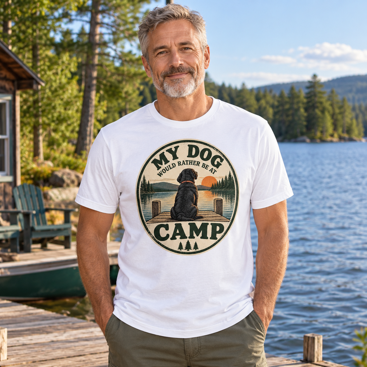 AI-generated lifestyle mockup of a grey-haired man wearing the white My Dog Would Rather Be at Camp tee at a lakeside camp.