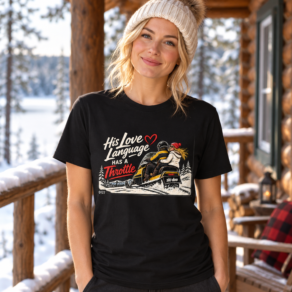 AI-generated lifestyle mockup of a woman wearing the black His Love Language Has a Throttle tee on a snowy cabin porch.